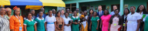 Gavi CEO Sania Nishtar photographed with health workers at the Ominako Community-Based Health Planning and Services (CHPS) facility in the Eastern Region of Ghana